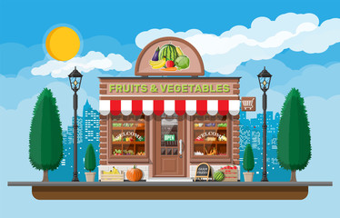 Wall Mural - Street brick shop building exterior. Fruit and vegetable store. Fresh organic food products. Cucumber tomato pumpkin carrot corn pepper banana. Nature cityscape panorama. Flat vector illustration