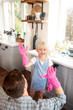 © zinkevych - Father and daughter giving high five before starting cleaning