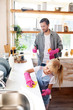© zinkevych - Daughter wearing gloves helping daddy to clean kitchen
