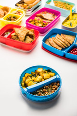 Wall Mural - group of Lunch Box / Tiffin for Indian kids, showing variety or multiple option or combination of healthy food for your school going children