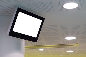 Wall Mural - Blank monitor mock up template. Digital display screen hang up high in a queue areas/waiting room