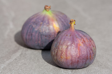 Fresh fig fruits on grey background.