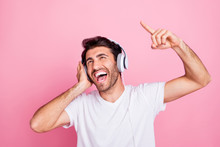 Portrait Of Funny Funky Crazy Middle Eastern Man Have Free Time Listen To Headset Sing Enjoy New Melody Raise Index Finger Wear Style White Stylish T-shirt Isolated Over Pink Color Background