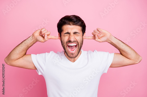 Stop irritating me. Portrait of upset negative emotions middle eastern man close cover ears index finger dont want listen argument with his wife wear trend clothes isolated pastel color background