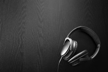 Image Of Headphones Isolated On Black Background Illuminated By Spotlights.
