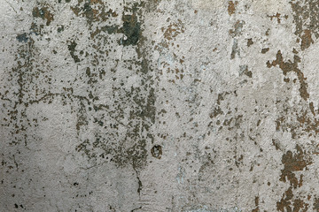 Wall Mural - Texture of messy old cracked stone or cement wall in the sunlight for pattern, background. Cracked concrete wall as background. Selective focus old cracked stucco