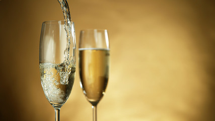 Wall Mural - Pouring champagne wine into goblet