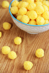 round yellow natural corn balls for breakfast in a ceramic a plate