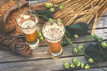 Fresh cold beer glasses in rustic setting