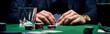 panoramic shot of man holding playing cards near glass and poker cards