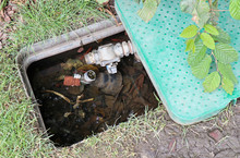 Water Meter With Opened Cover Outdoors