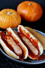 Poster - Hot Dog for Halloween. a hot dog sausage in a severed finger in abundance ketchup as blood. Food Ghoul. 