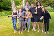 © Mangostar - Happy yoga group with mats in park. Cheerful young men and women in sportswear holding yoga mats and smiling at camera in park. Yoga concept