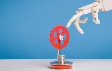 Aufkleber - Robot hand touching red plastic gear, blue background