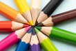 © Poh Smith - Top view of colourful crayons or colour pencil set in range isolated on pastel indigo blue background.Education,Business office and Arts Concept.Copy space empty blank for text.Back to school