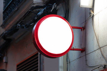 Wall Mural - Blank round store signboard mockup. Empty circular illuminated shop lightbox template. Street sign