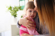 © H_Ko - Doctor hugging scared crying little baby girl visiting her office portrait