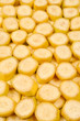 © Nikolay - Fresh banana slices background. Top view.