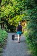 © David Pastyka - Border collie puppy, 4 months old on the walk with her owner, young woman.