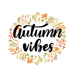 Wall Mural - Hello autumn hand lettering phrase on orange watercolor maple leaf background