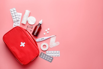 Wall Mural - First aid kit on color background