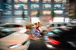 © Westend61 - Long exposure photo of two women running through the streets in the city at night