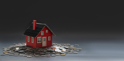 Sticker - Real estate and property investment concept : small house model on stack of coins