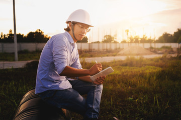 Wall Mural - Male architect, inspecting house construction