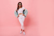 © ClaudiK - Fashionable full length image of  woman with long ginger hair happy laughing to camera. Indoor photo of blissful caucasian girl in trendy sunglasses and mint green  jacket.