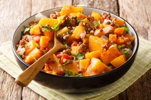 Low-calorie Hot Stew Of Pumpkin, Lentils, Onions And Carrots Close-up In A Bowl. Horizontal