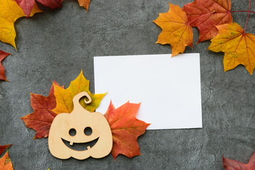 Wall Mural - autumn composition. maple leaves and decorative pumpkin. flat lay, top view. mockup