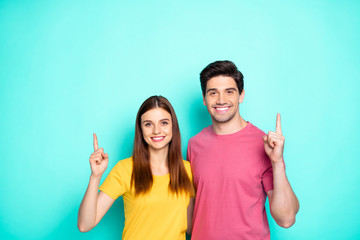 Sticker - Portrait of his he her she nice attractive lovely charming cheerful cheery content couple hugging pointing up ad advert news novelty isolated over bright vivid shine vibrant green turquoise background