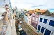 Window ledge view of colorful colonial buildings lining traditional cobblestone streets in the bohemian Carmo neighborhood, near the Pelourinho tourist district of Salvador, Bahia, Brazil