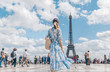 Attractive girl in a dress in Paris