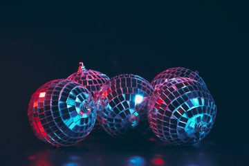 Wall Mural - Group of shiny Disco Balls on dark background close up