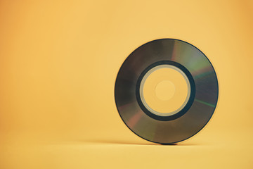 Aufkleber - Close up Beautiful Old mini disk on yellow background.