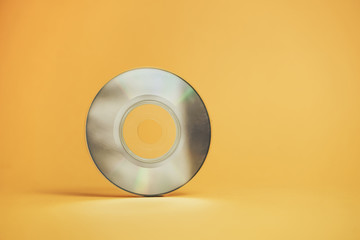 Aufkleber - Close up Beautiful Old mini disk on yellow background.