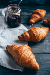 delicious croissants on wooden table