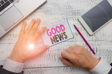 Conceptual hand writing showing Good News. Concept meaning Someone or something positive,encouraging,uplifting,or desirable