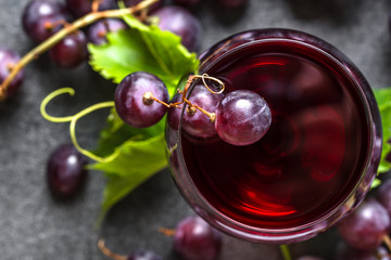 Wall Mural - Fresh grapes and glass of red wine, top view