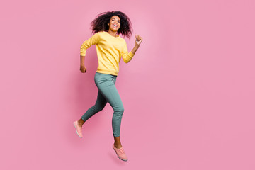 Wall Mural - Season of discount concept. Full length body size photo of excited optimistic lucky carefree expressing hipster teenager jumping up in hurry to get best getaway wear casual clothes isolated background