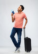 © Syda Productions - family, tourism and vacation concept - happy indian man in polo shirt with travel bag, passport and air ticket looking up over grey background
