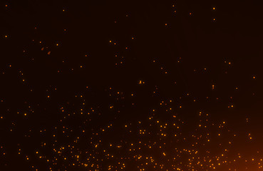 Wall Mural - abstract background of flickering gold particles and light flare