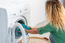 Young Woman, Load The Wash Machine For Cleaning Laundrys 