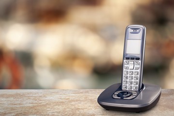 Poster - Cordless phone with cradle on white background