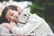 © lalalululala - Asian child playing with british cat in the park