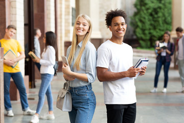 College students posing to camera in university campus