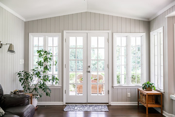 Wall Mural - Large and open living room den sun room with windows on two sides and lots of natural light flowing in. Rear entrance back door to home