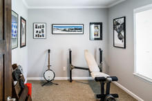 Man Cave Music Room Inside A 1950's Style Home With Musical Instruments And A Workout Area