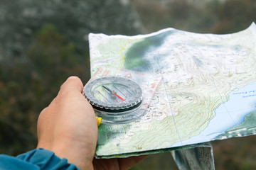 Orienteering with compass and topographic map